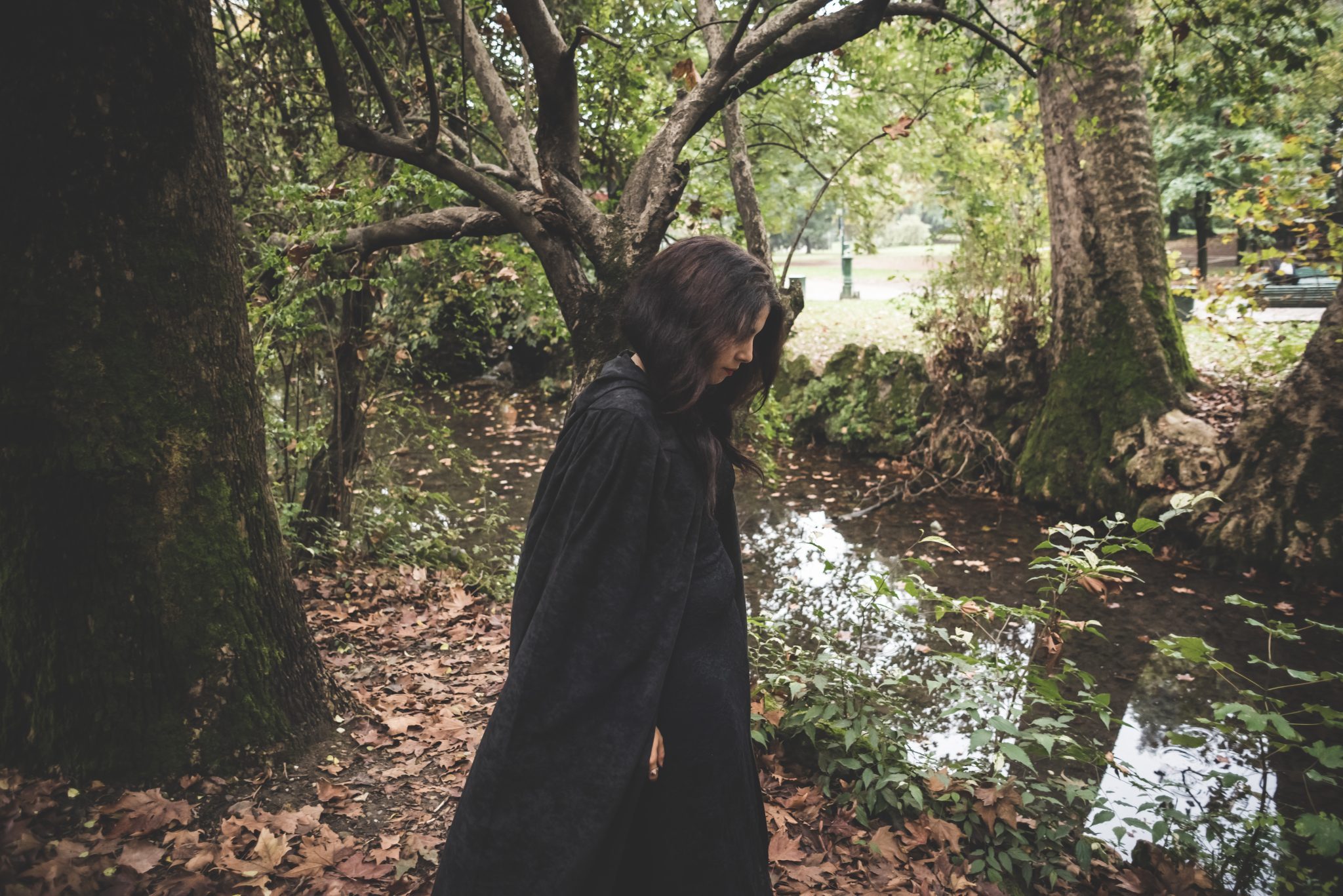 Dark woman with black mantl